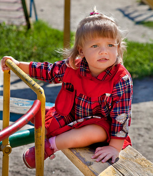 istock Adorable little girl having fun on a swing 149396796