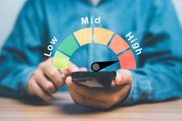 istock Businessman using smartphone with risk level indicator rating infographic since low to high for Risk management and assessment concept. 1493969268