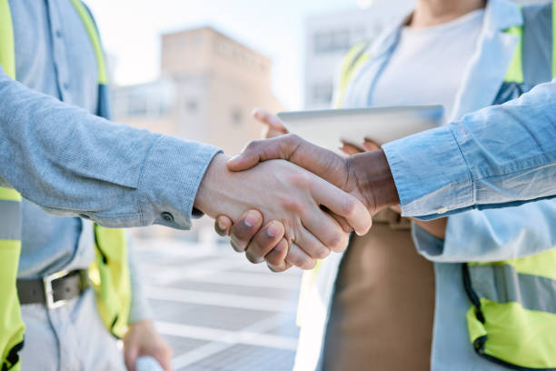 istock Handshake, engineering and meeting with people and solar panels for partnership, renewable energy or deal. Agreement, sustainability and thank you with engineer shaking hands for eco, b2b or welcome 1493972460