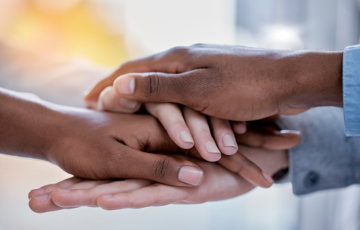 Business people, diversity and hands together in trust, partnership or collaboration at office. Group of diverse employee workers piling hand in teamwork support, agreement or solidarity at workplace