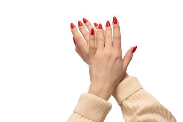 istock Woman hands with red nails isolated on a white background. 1493977106
