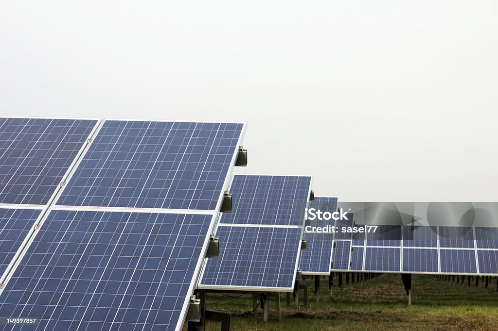 Park with solar cells Park with solar cells in front of an overcast sky Public Park Stock Photo