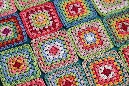 Handmade crocheting, needlework and handicraft concept - crocheting accessories