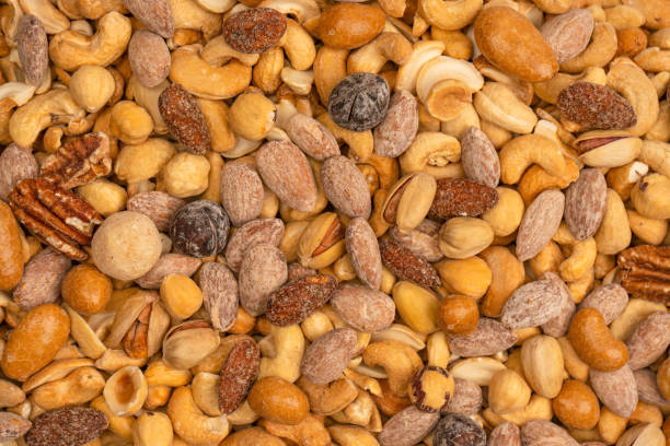 istock A group of almonds, pistachios, walnuts, macadamia, cashews. 1493980691