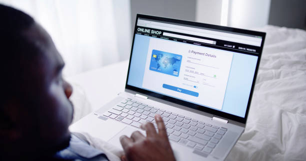 istock African American Online Shopping In Bed 1493983604