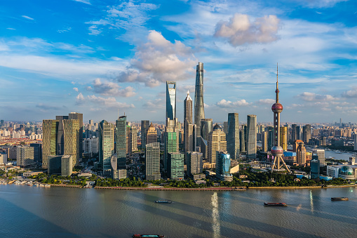 Aerial view of Shanghai city skyline and modern buildings at sunset, China.