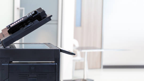 istock photocopier or network printer is office worker tool equipment for scanning and copy paper. 1493986664