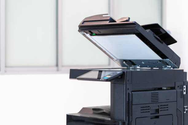 istock photocopier or network printer is office worker tool equipment for scanning and copy paper. 1493986665