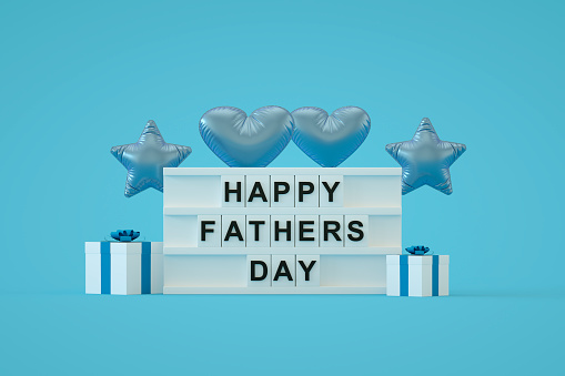 Happy Fathers Day on light box, blue background, Digitally generated image.