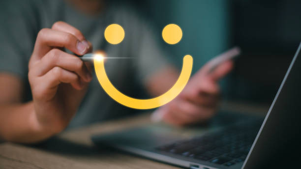 istock Women hand drawing a smiling happy face on a futuristic virtual interface screen. Client satisfaction, service, or product evaluation concept. 1493987902