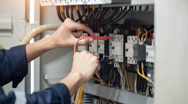 istock Electrician engineer work tester measuring voltage and current of power electric line in electical cabinet control , concept check the operation of the electrical system . 1493988198