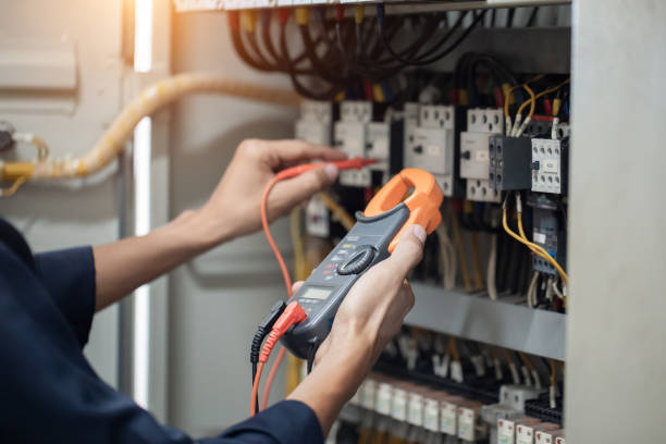 istock Electrician engineer work tester measuring voltage and current of power electric line in electical cabinet control , concept check the operation of the electrical system . 1493988200