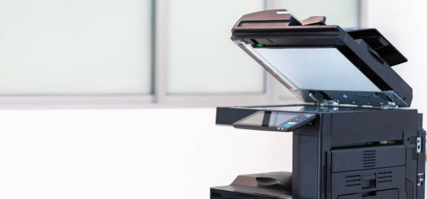 istock photocopier or network printer is office worker tool equipment for scanning and copy paper. 1493988769