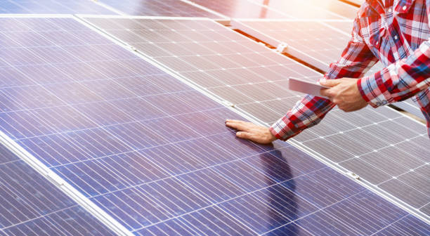 istock Installation, Technical checking up, and performance assessment of solar energy panels. 1493995647