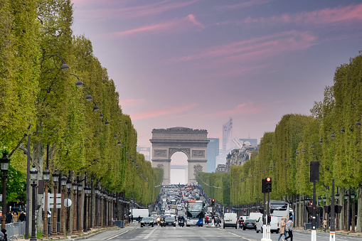 Paris, France - April 24, 2023: Road of Champs Elysee leading to Arc de Triomphe - The most famous avenue of Paris