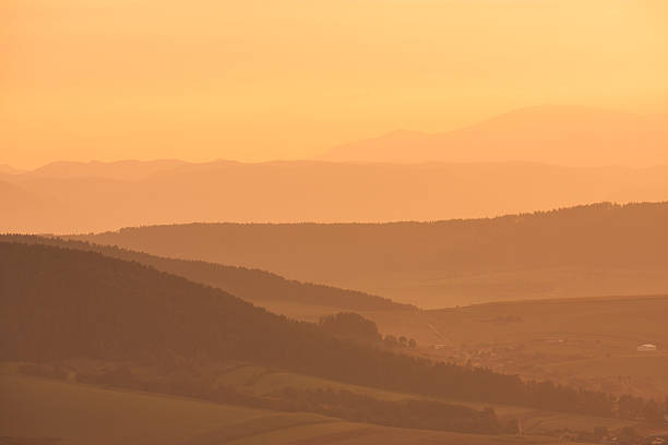 Overview of layered hills seen from Spissky castle stock photo
