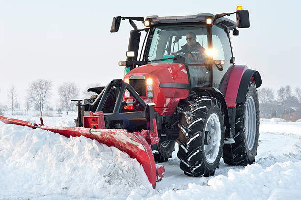 istock A red tractor cleaning snow from a road 149400106
