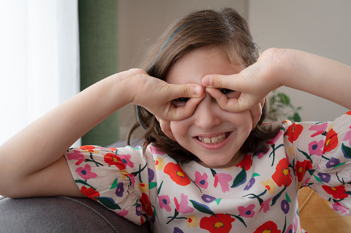 little cheerful girl looking at camera. portrait