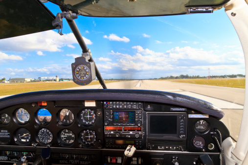 Cockpit view from small aircraft taking off from runway