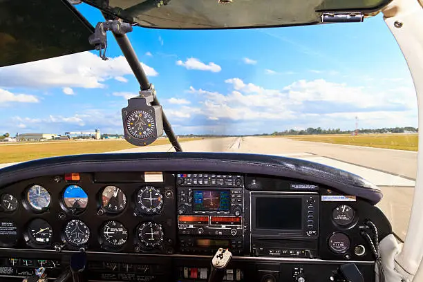 Photo of Cockpit view - Small aircraft taking off from runway