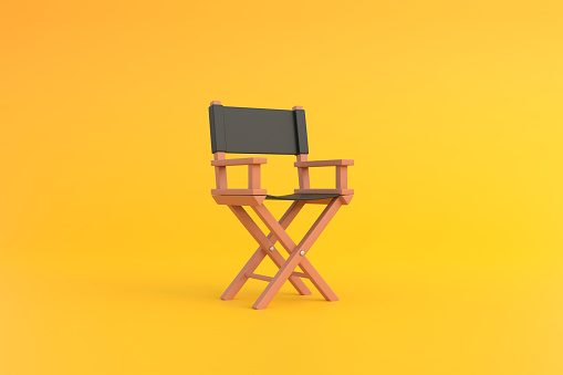 Director chair on yellow background. Movie industry concept. Cinema production design concept. 3d rendering illustration