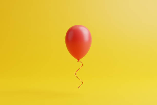istock One red balloon on a yellow background 1494003064
