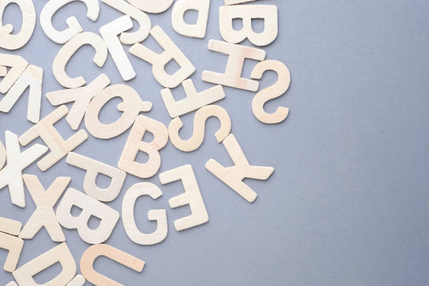 istock Scattered Wooden English Alphabets 1494003121