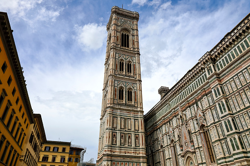 Giotto's Campanile, this majestic free-standing bell tower is part of the building complex of the Cathedral of Santa Maria Del Fiore and is the undisputed masterpiece of Italian Gothic. Florence, Italy.