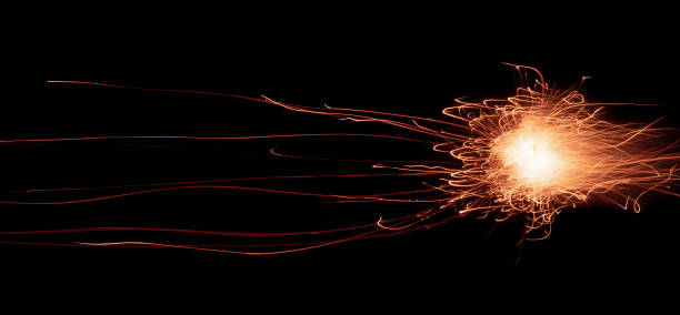 istock fire in dark. luminous lines of sparks. explosion black powder. 1494004199