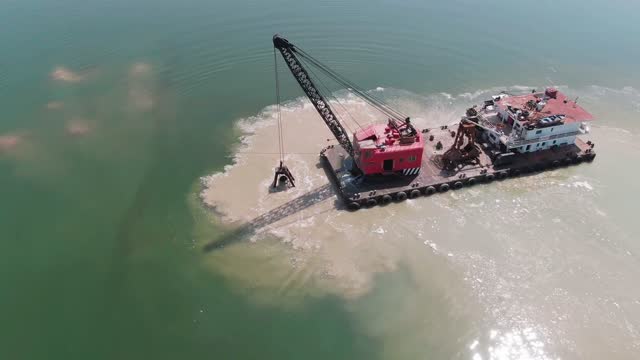A bird's-eye view of the sludge removal vessel at work