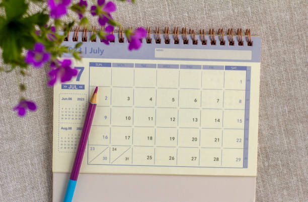 istock Desktop calendar for July 2023 on the table with a space to copy. 1494016201