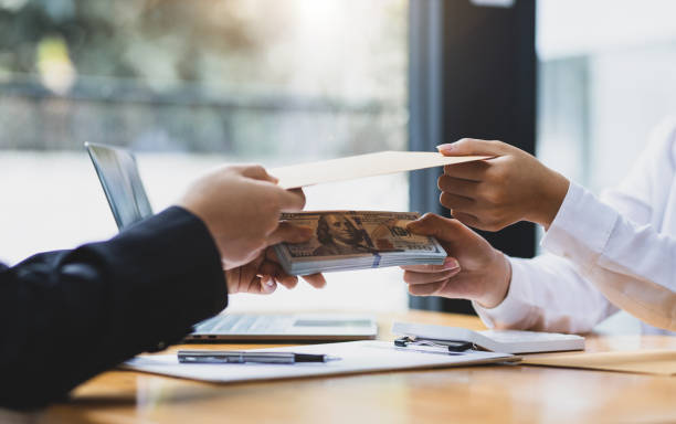istock The concept of paying or bribing officials. 1494019143