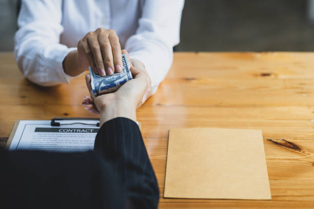 istock The concept of paying or bribing officials. 1494019171