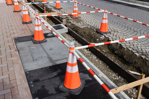 istock road construction site with traffic cones and warning tape 1494023058