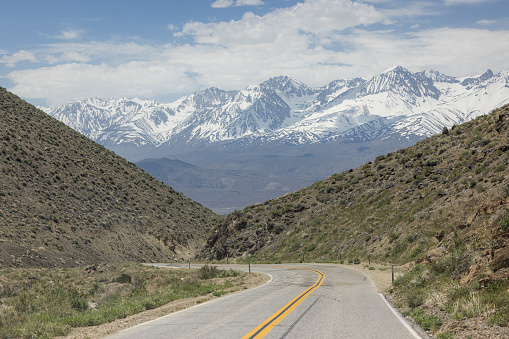 Beautiful scenic drive with the Eastern Sierra Nevadas covered in snow after a record winter 2022 and 2023