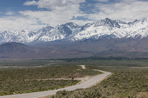Beautiful scenic drive with the Eastern Sierra Nevadas covered in snow after a record winter 2022 and 2023