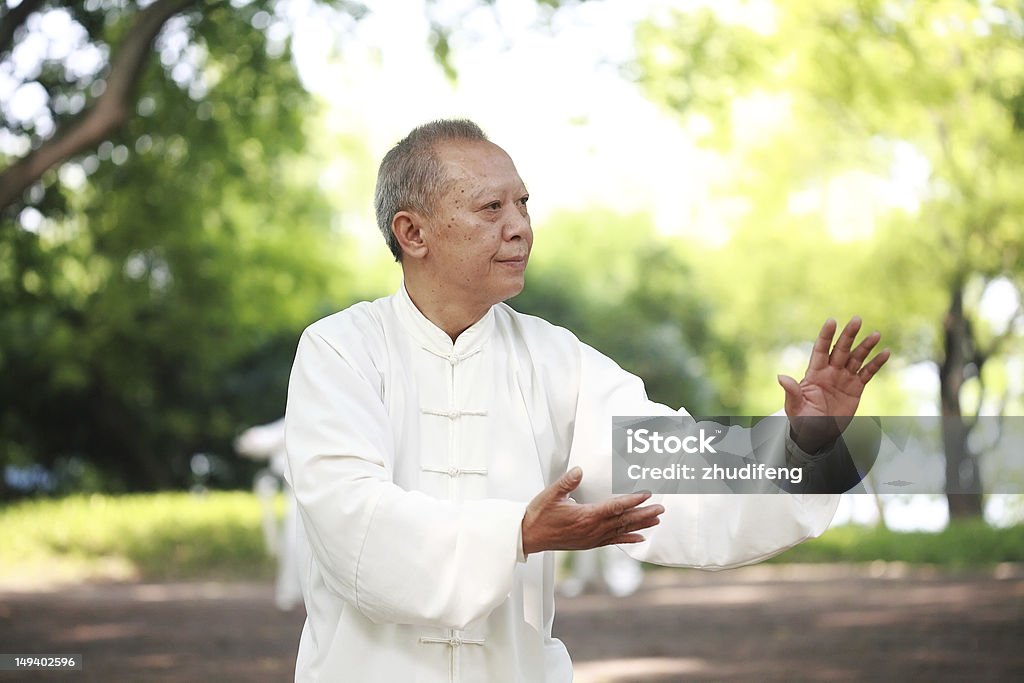 asian old man taichi outdoor Tai Chi Stock Photo