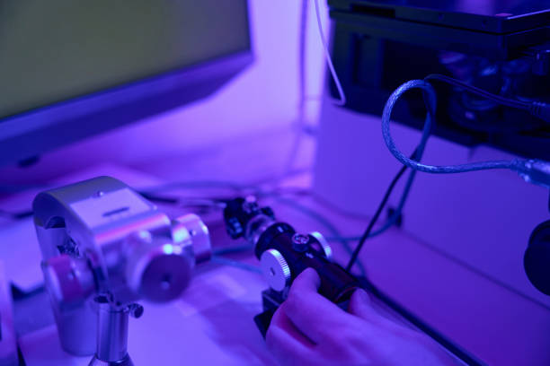 istock Male laboratory worker controlling joystick of micromanipulator 1494029084