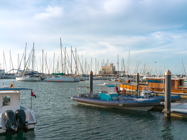 istock Nautical Traditions: A Fisherman Skillfully Casting a Fishnet from a Traditional Boat 1494029414