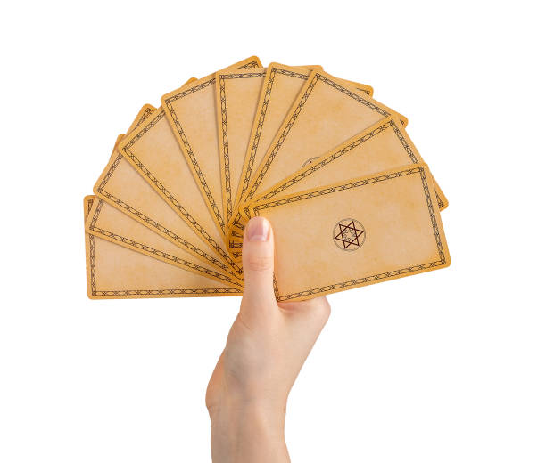 istock Hand holding tarot cards with back view, backside design isolated on white background 1494029638