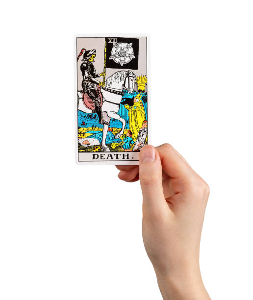 istock Death, tarot card in hand, bad negative major arcana isolated on white 1494029645