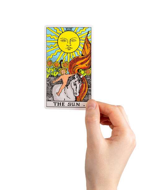 istock Sun, tarot card in hand, positive major arcana isolated on white 1494029646