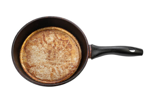 istock Old empty frying pan isolated on white background. 1494030034