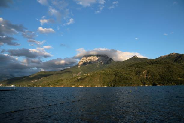 istock there is a boat in the ocean under a large mountain 1494032262