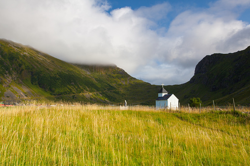 Small white chapel on the cemetery near the Bostad, Lofoten island, Norway