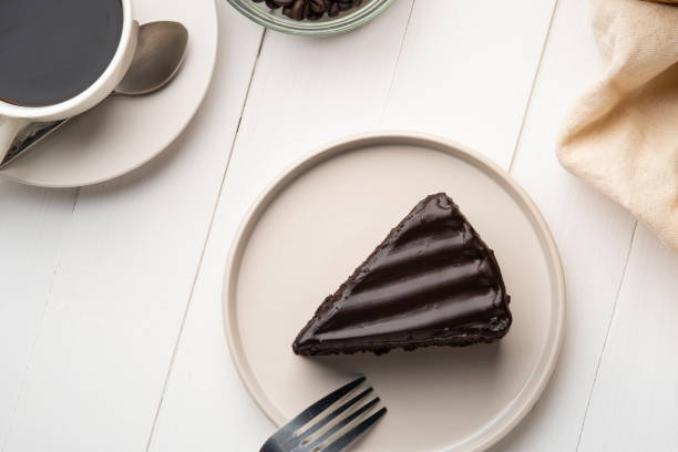 istock Delicious Sliced of Classic Chocolate Cake on white plate 1494034099