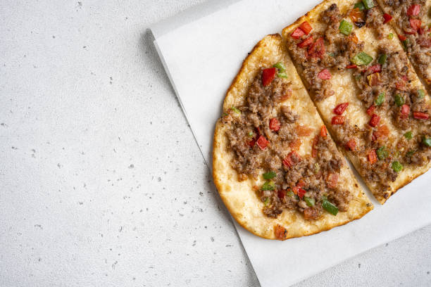 istock Turkish pizza Turkish pide with minced meat, on gray concrete table background, top view flat lay, with copy space for text 1494035415