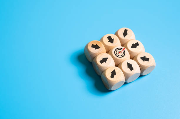 istock Selective focus at wood brick with icon of target customer with arrow pointing on target. SEO tools which can increase sale and revenue. Marketing icon concept on plain background with copy space. 1494035588