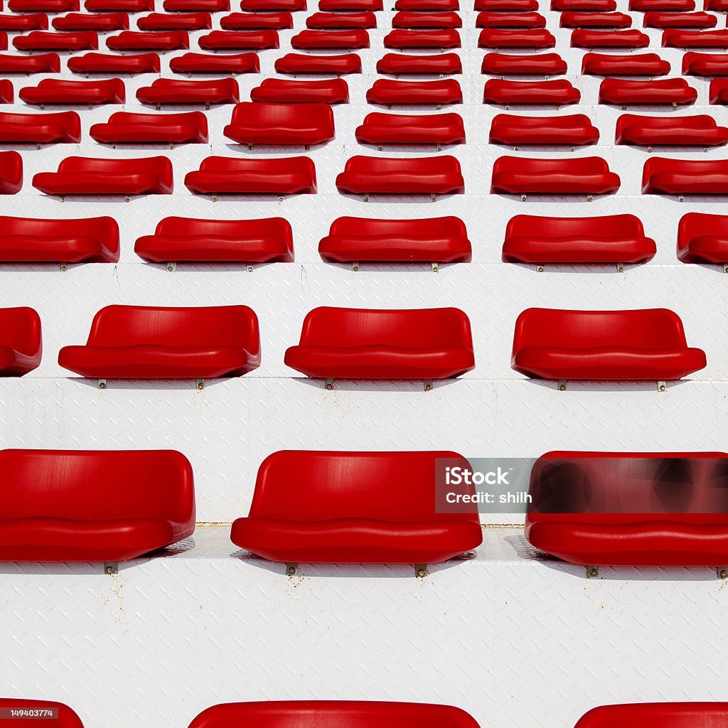 Row of Empty Red Stadium or Arena Seats Day Stock Photo