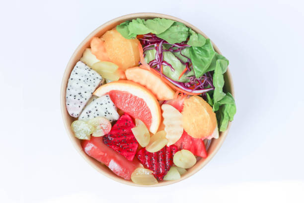 istock fruit and vegetable salad or orange, dragon fruit and lettuce salad 1494037801